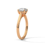 Rose gold ring with a large diamond on a white background 