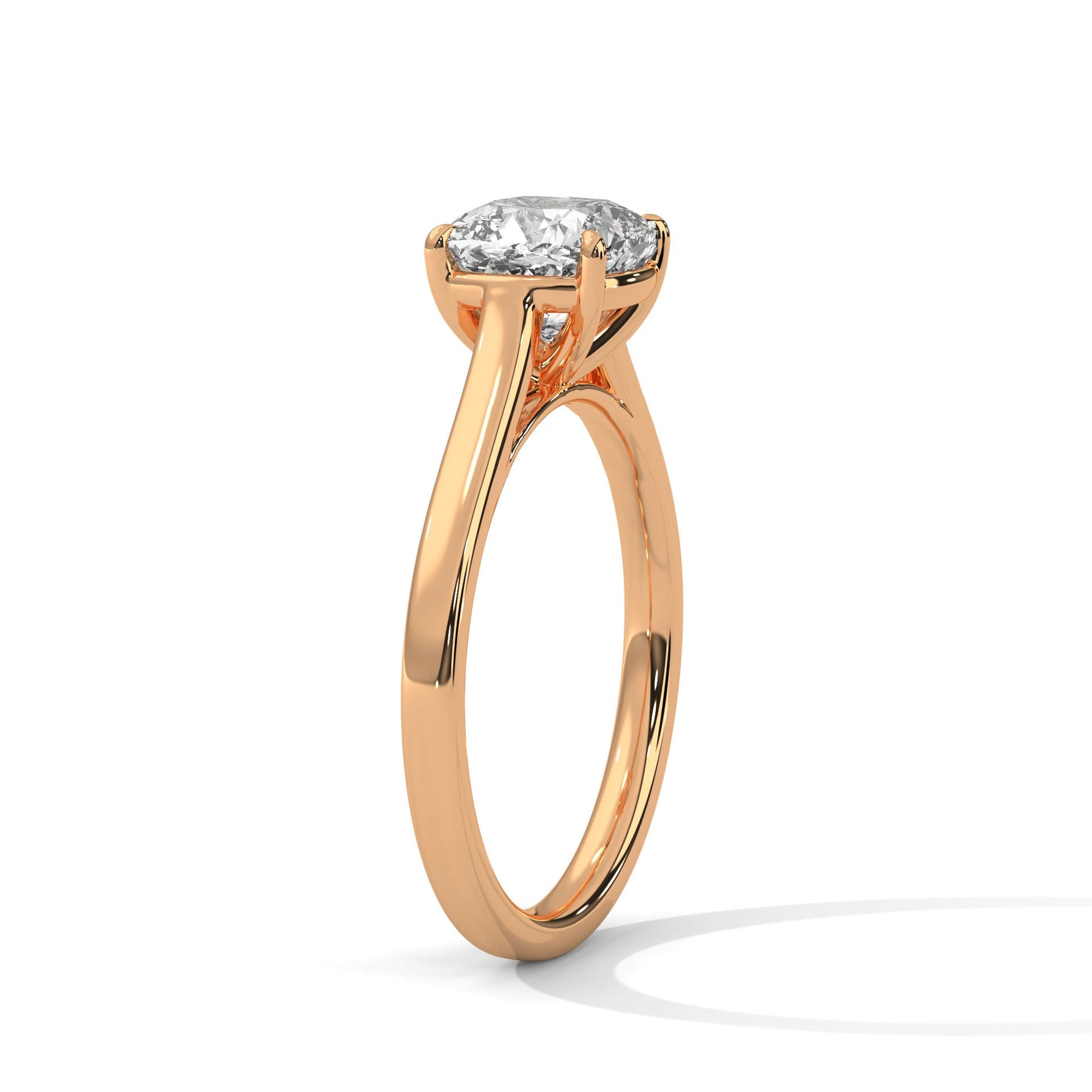 Rose gold ring with a large diamond on a white background 