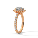 Rose gold ring with a large diamond on a white background 