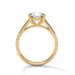 Gold ring with a large diamond on a white background 