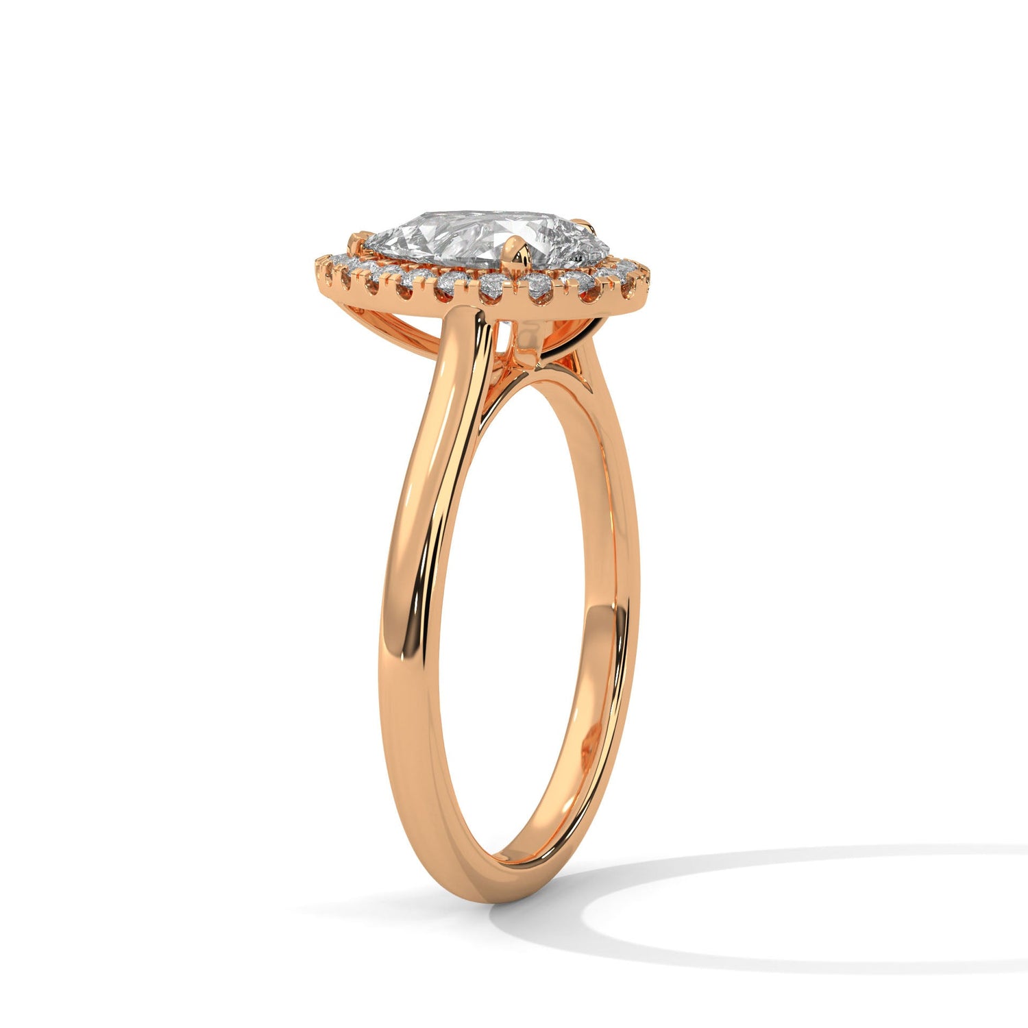 Rose gold ring with a large diamond on a white background 