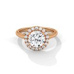 Rose gold ring with a large diamond on a white background 