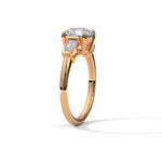 Rose gold ring with a large diamond on a white background 
