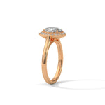 Rose gold ring with a large diamond on a white background 