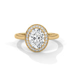 Gold ring with a large diamond on a white background 