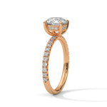 Rose gold ring with a large diamond on a white background 