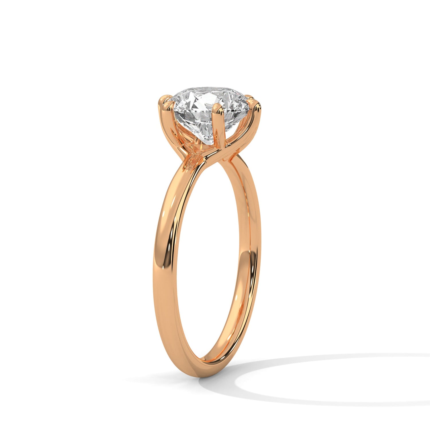 Rose gold ring with a large diamond on a white background 