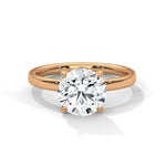 Rose gold ring with a large diamond on a white background 
