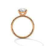 Rose gold ring with a large diamond on a white background 