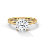 Gold ring with a large diamond on a white background 