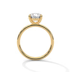 Gold ring with a large diamond on a white background 