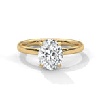 Gold ring with a large diamond on a white background 
