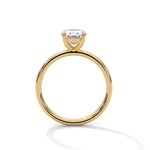 Gold ring with a large diamond on a white background 