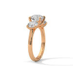 Rose gold ring with a large diamond on a white background 