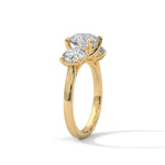 Gold ring with a large diamond on a white background 