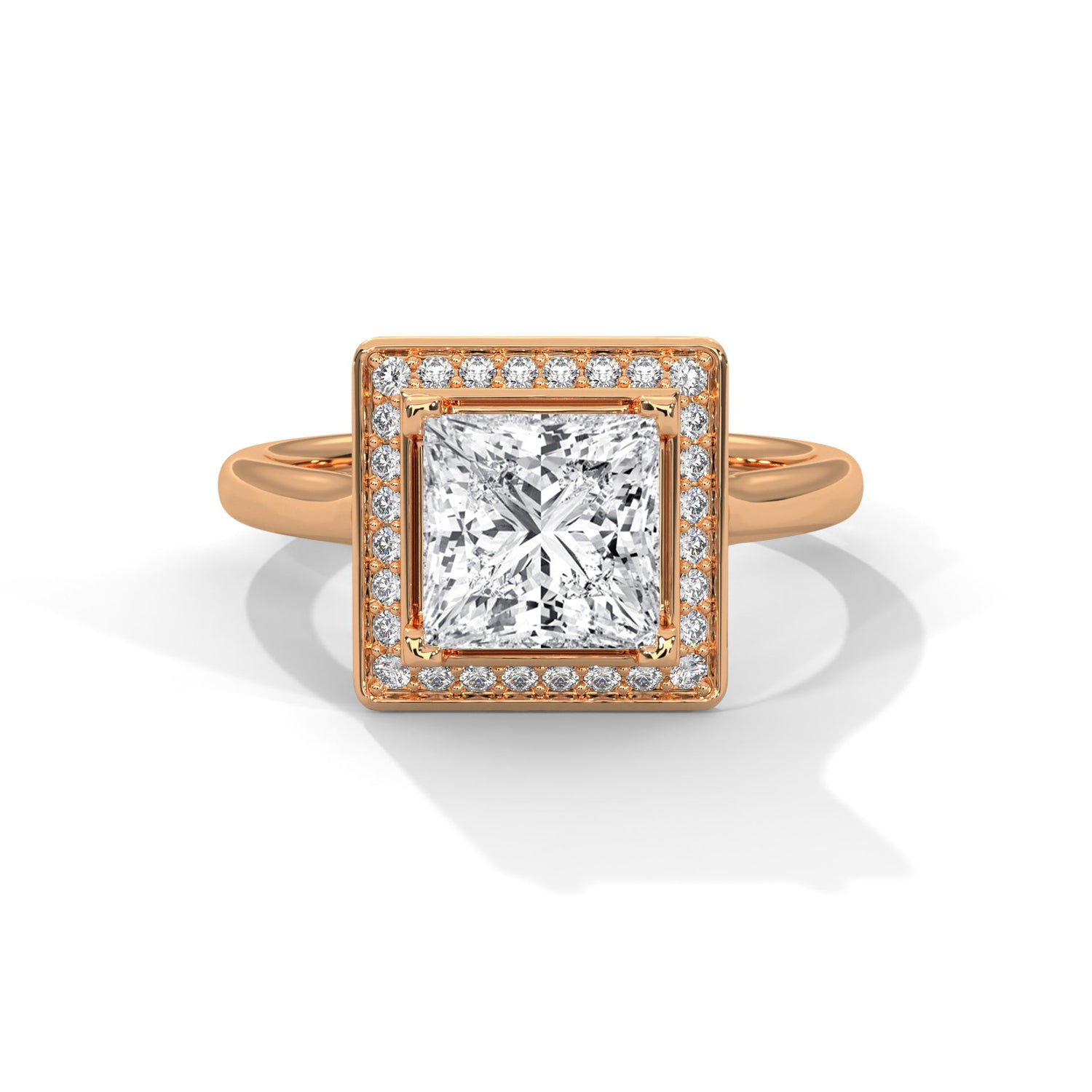 Rose gold ring with a large diamond on a white background 
