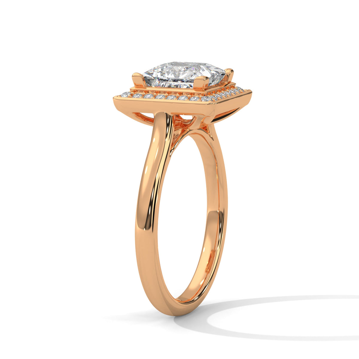 Rose gold ring with a large diamond on a white background 