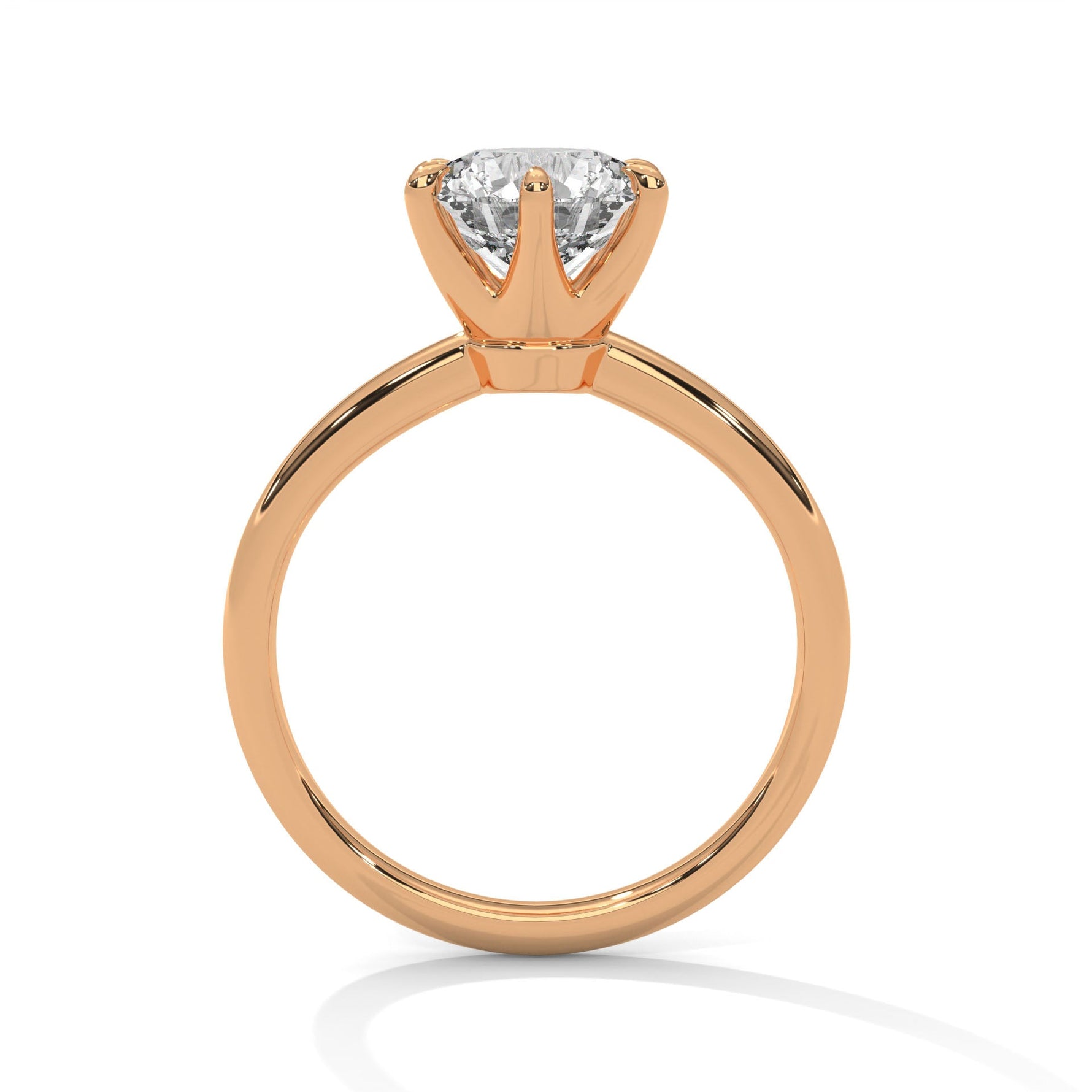 Rose gold ring with a large diamond on a white background 