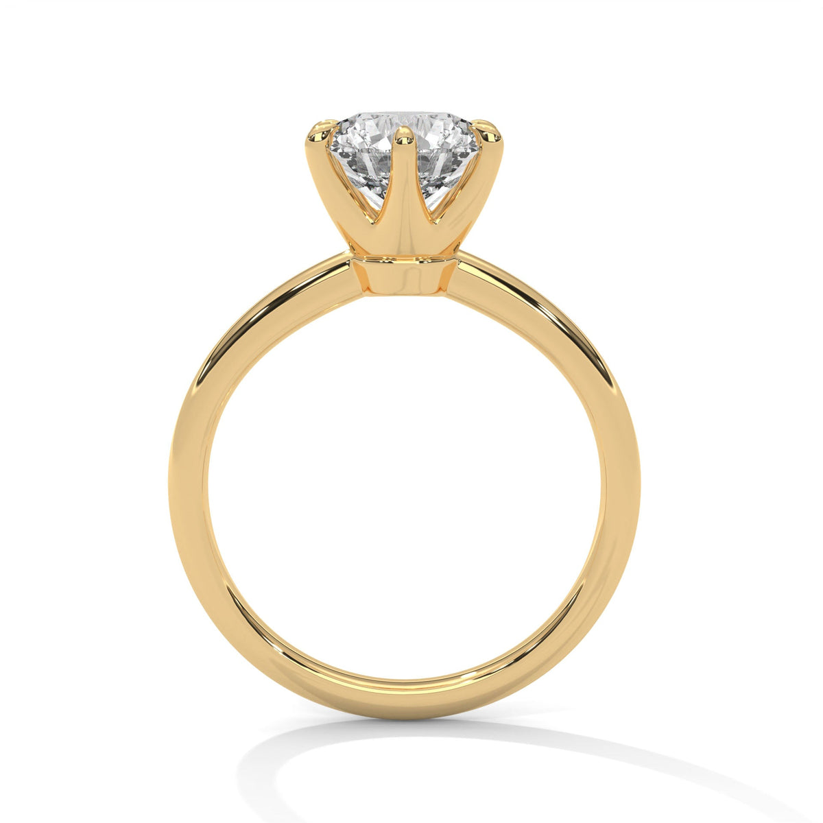 Gold ring with a large diamond on a white background 