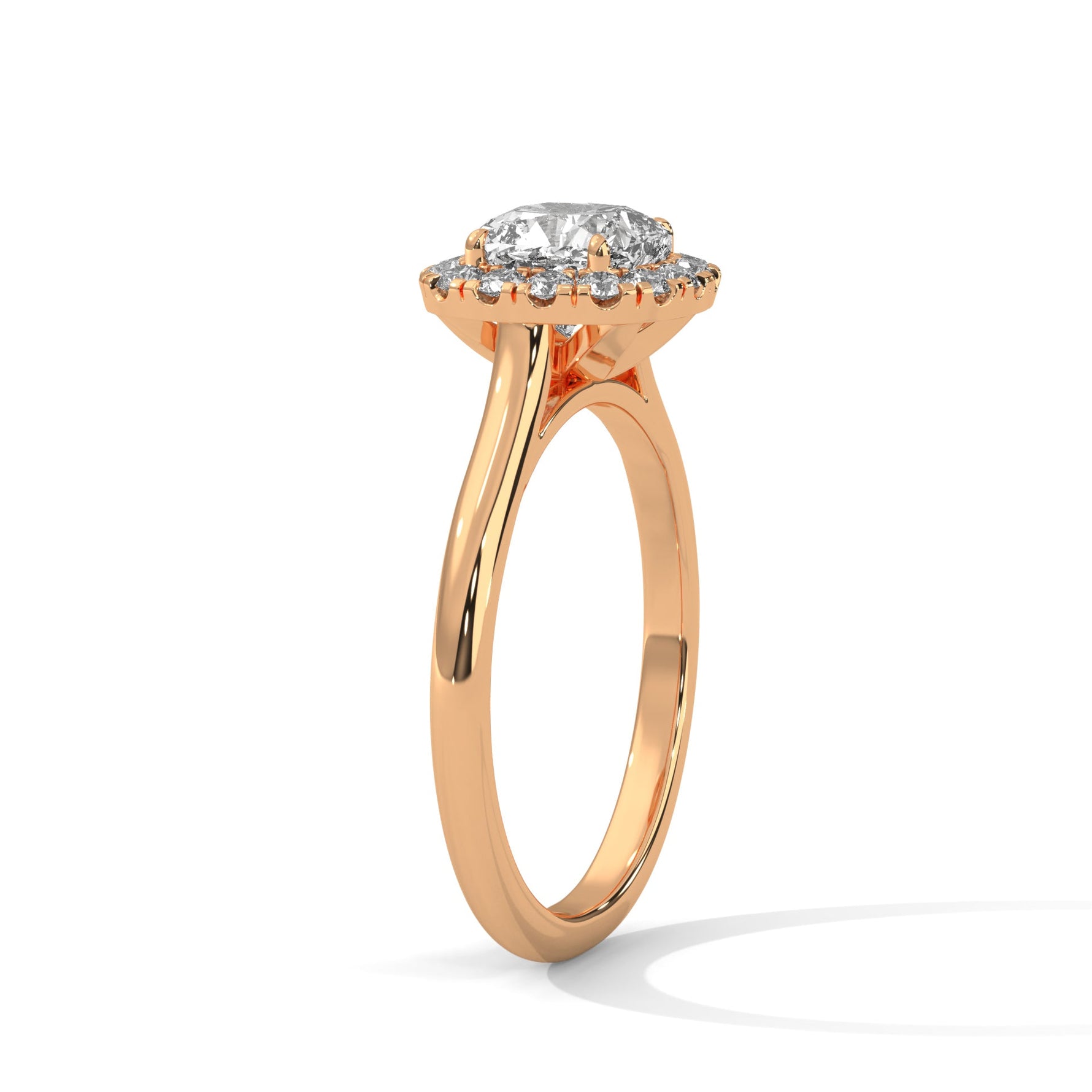 Rose gold ring with a large diamond on a white background 