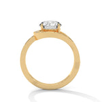Gold ring with a large diamond on a white background 