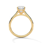 Gold ring with a large diamond on a white background 
