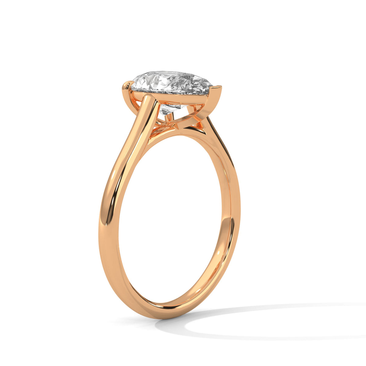Rose gold ring with a large diamond on a white background 
