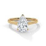Gold ring with a large diamond on a white background 