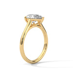 Gold ring with a large diamond on a white background 