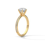 Gold ring with a large diamond on a white background 