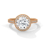 Rose gold ring with a large diamond on a white background 