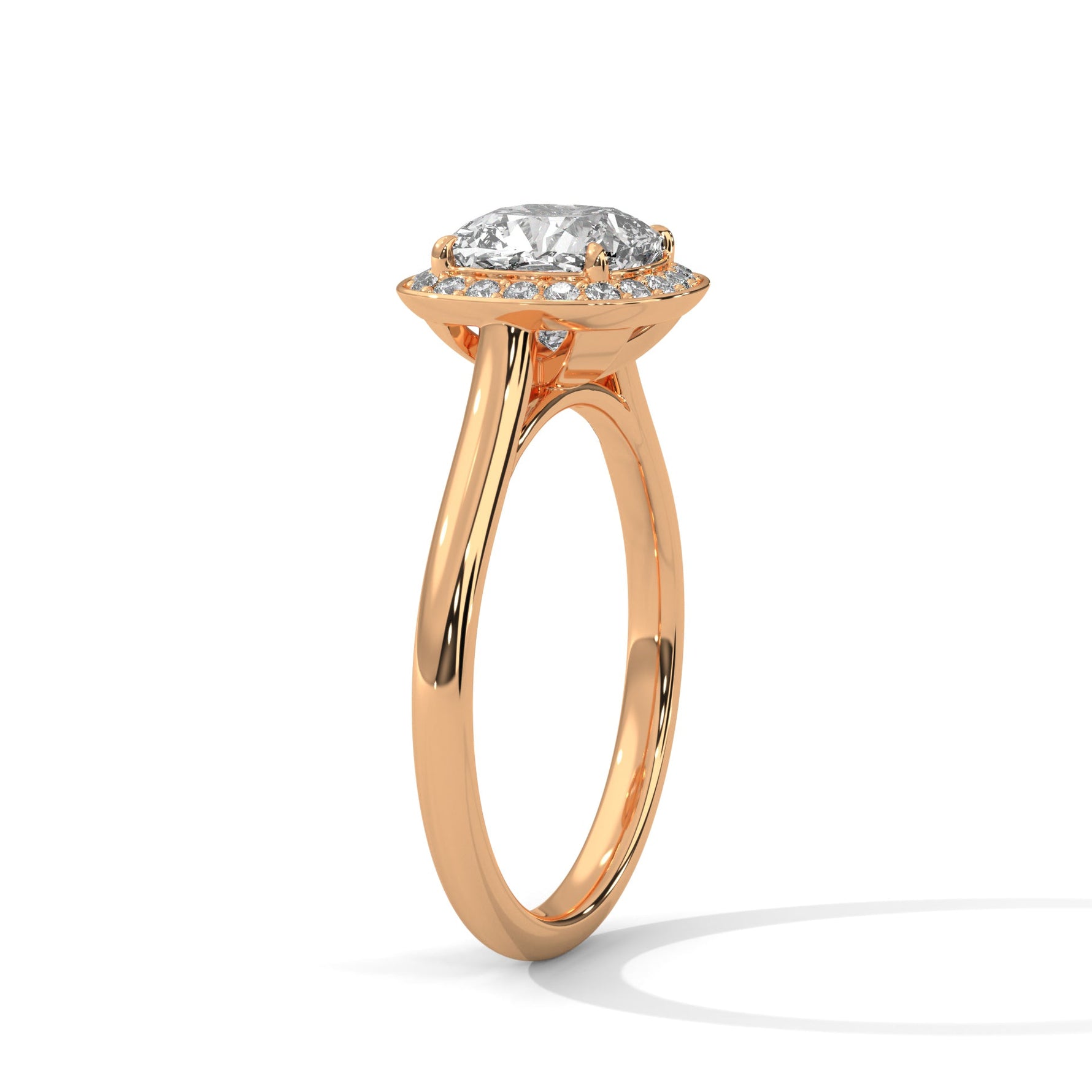 Rose gold ring with a large diamond on a white background 