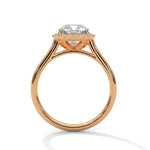 Rose gold ring with a large diamond on a white background 