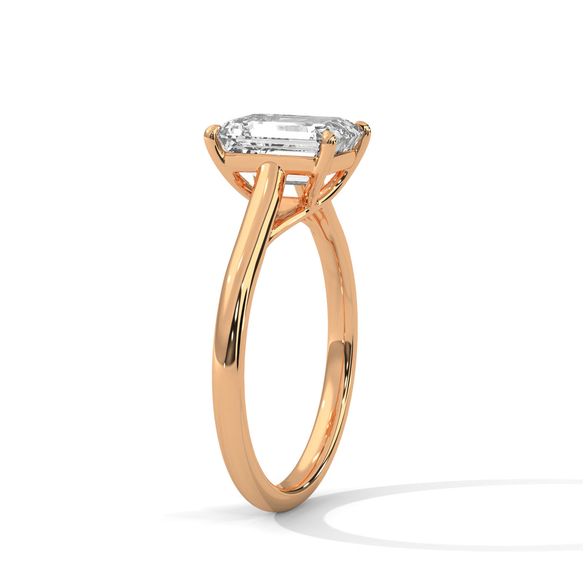 Rose gold ring with a large diamond on a white background 