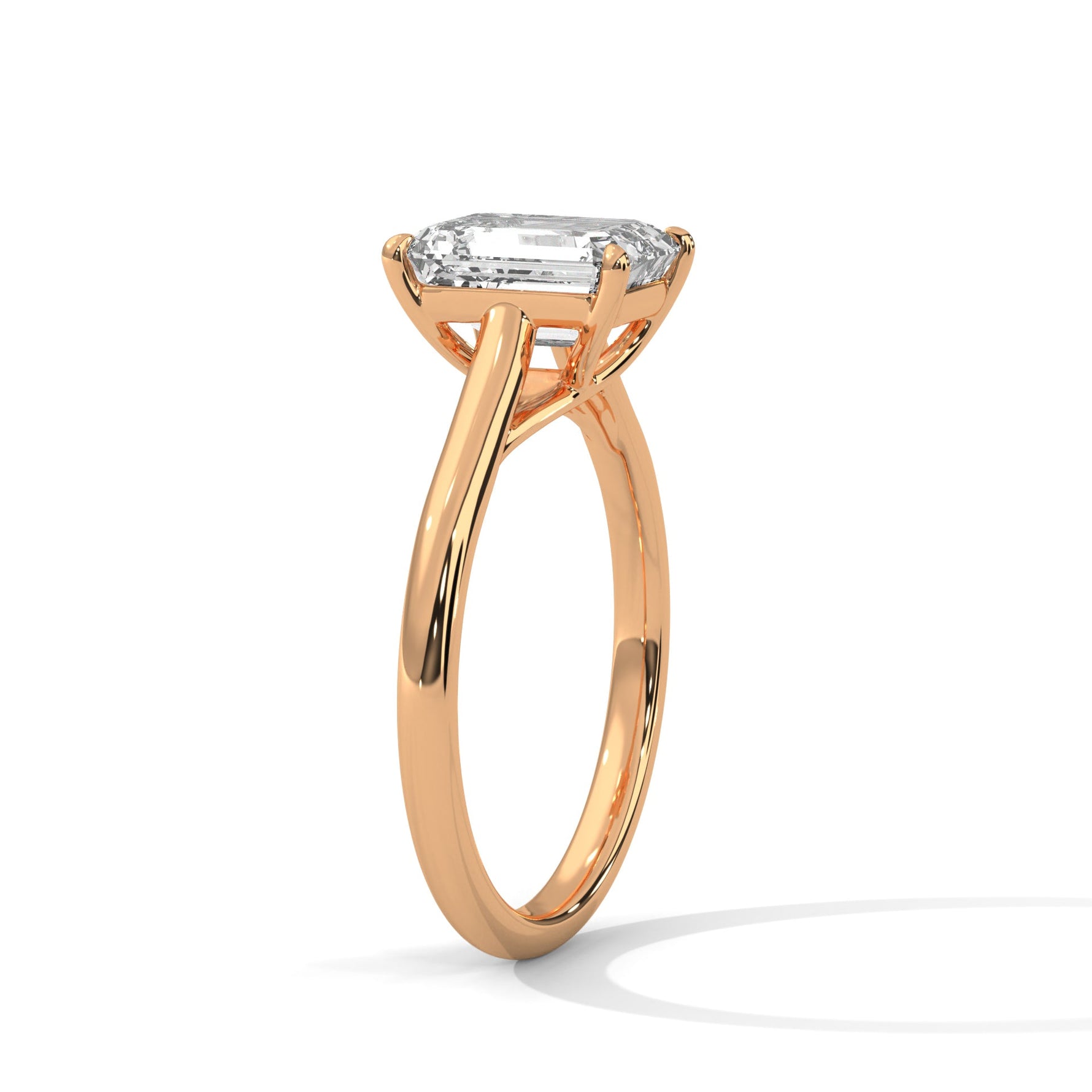 Rose gold ring with a large diamond on a white background 