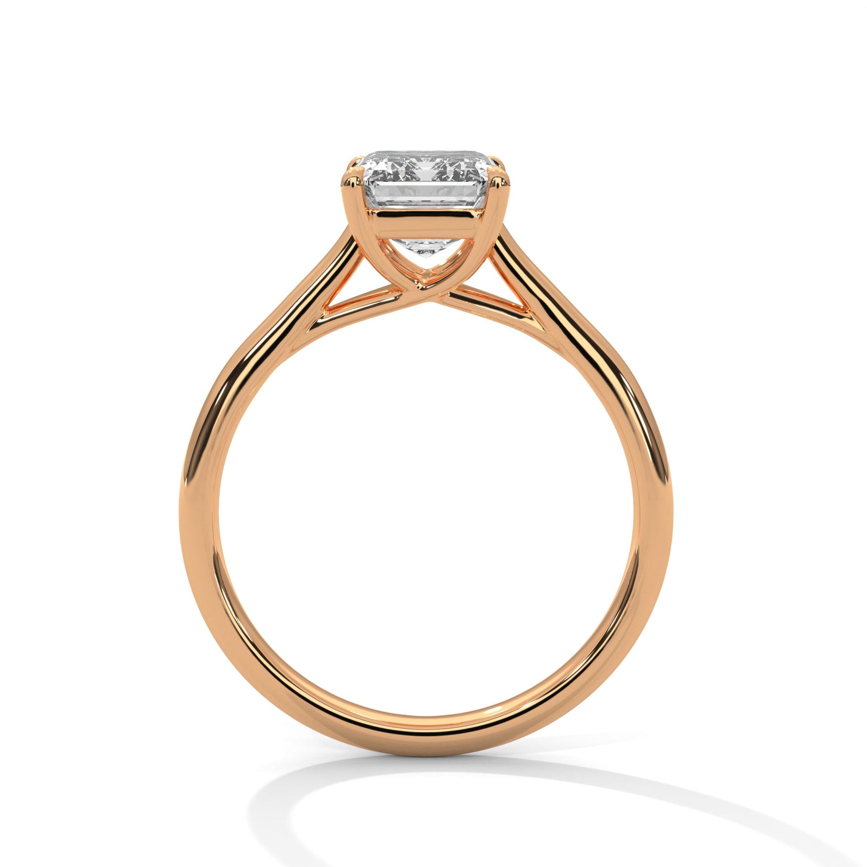Rose gold ring with a large diamond on a white background 