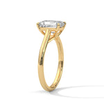 Gold ring with a large diamond on a white background 