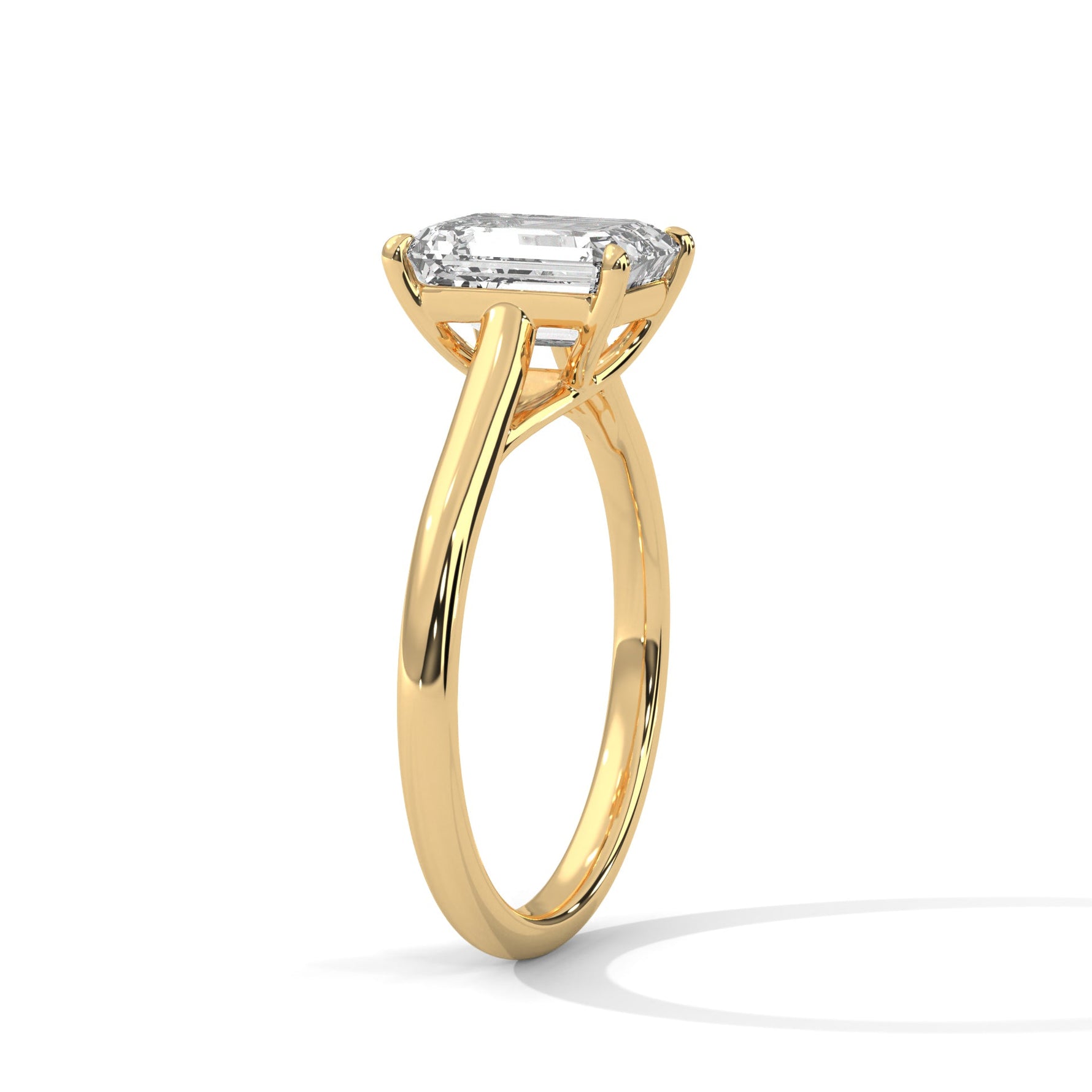 Gold ring with a large diamond on a white background 