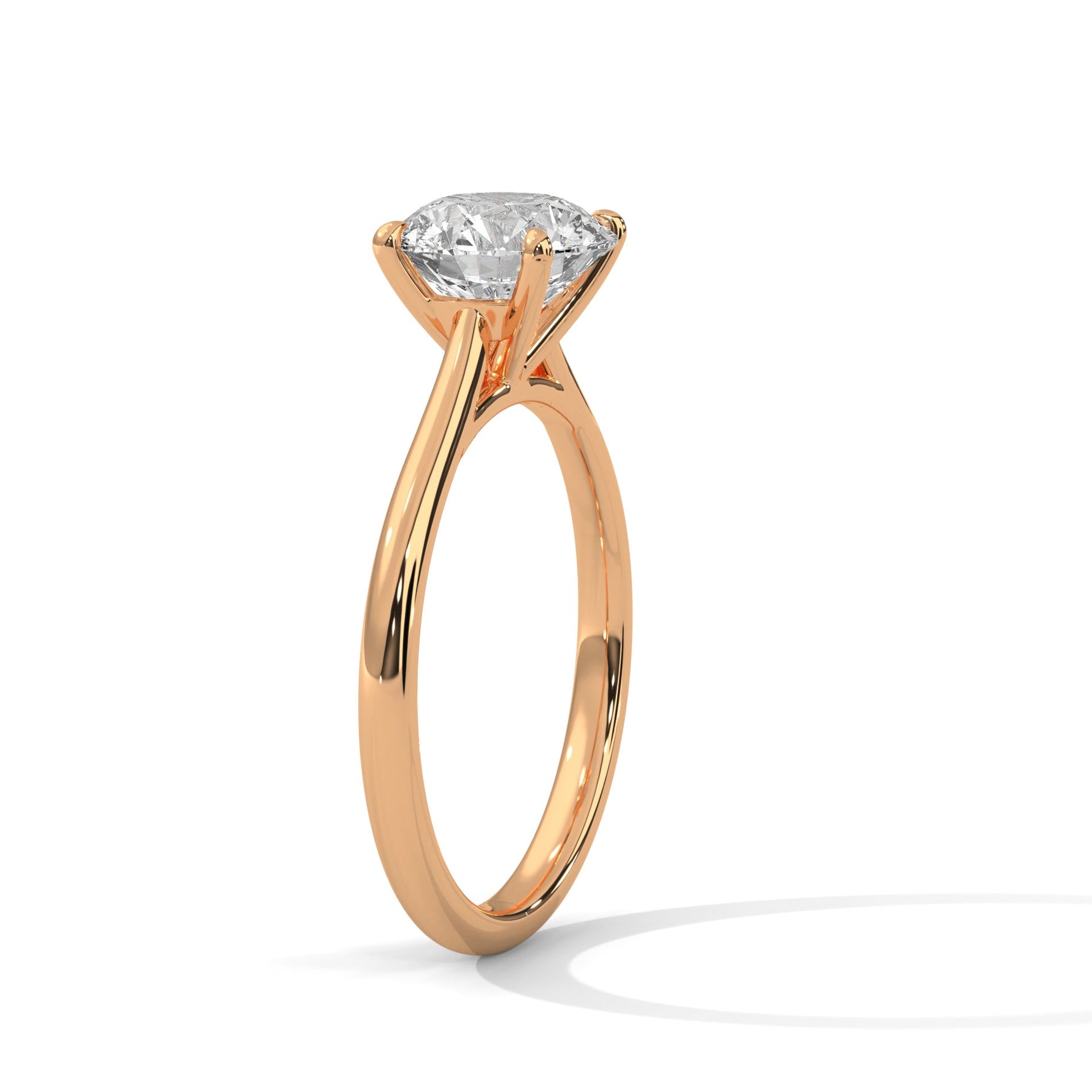 Rose gold ring with a large diamond on a white background 