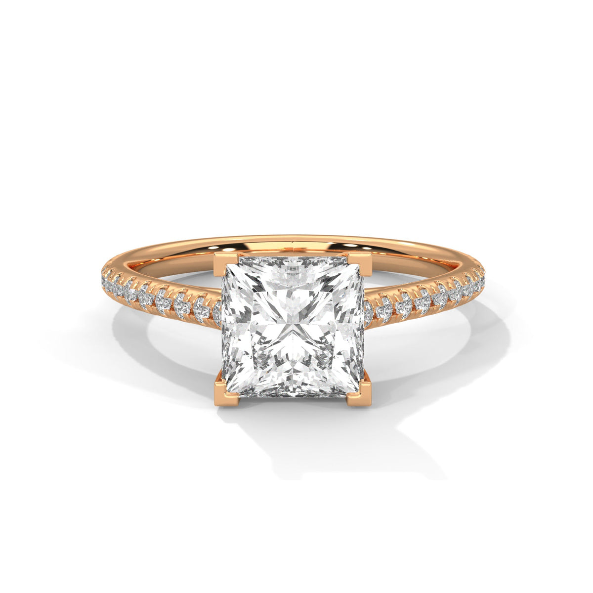 Rose gold ring with a large diamond on a white background 