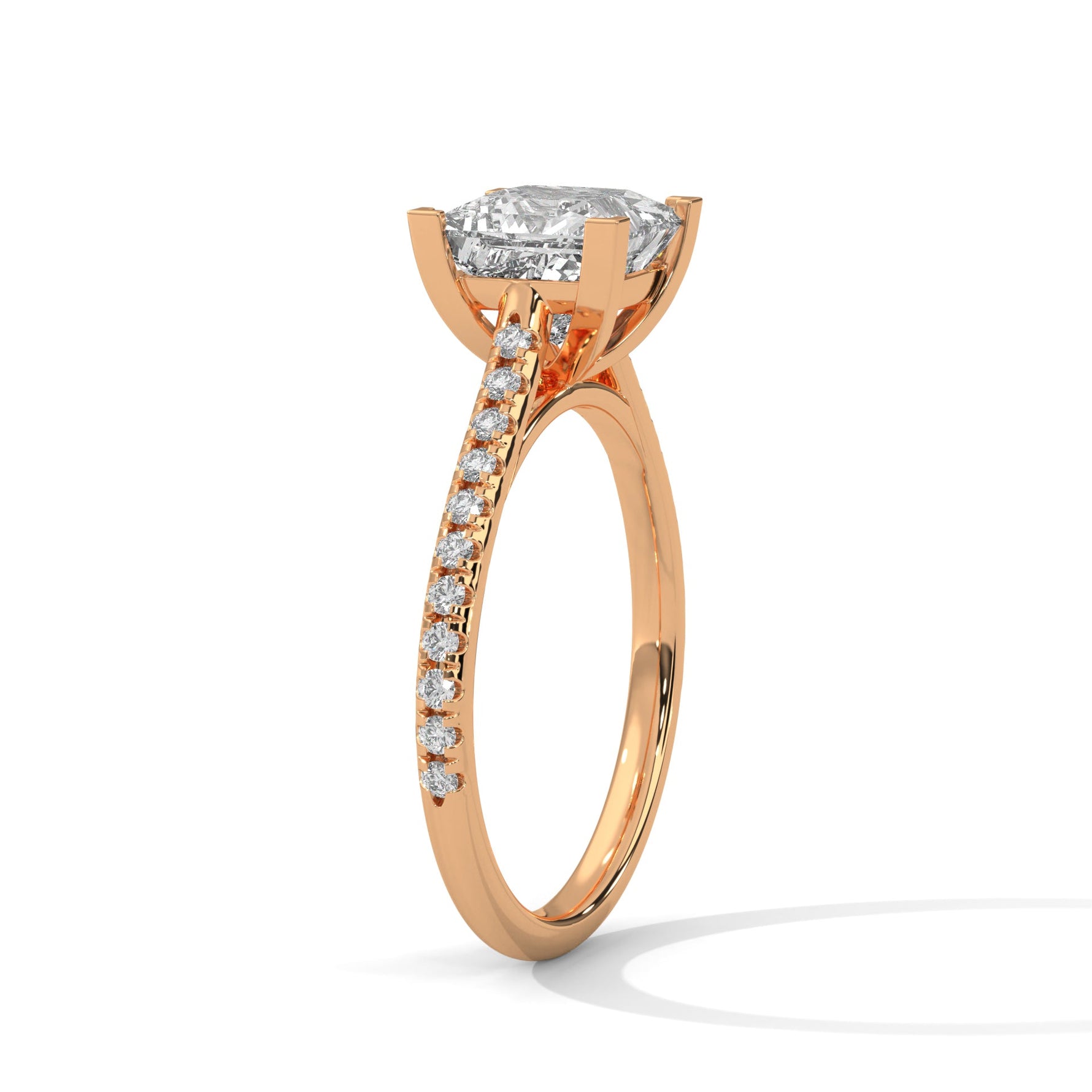Rose gold ring with a large diamond on a white background 