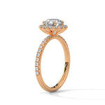 Rose gold ring with a large diamond on a white background 