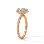 Rose gold ring with a large diamond on a white background 