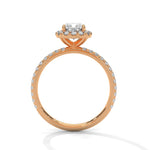 Rose gold ring with a large diamond on a white background 