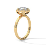 Gold ring with a large diamond on a white background 