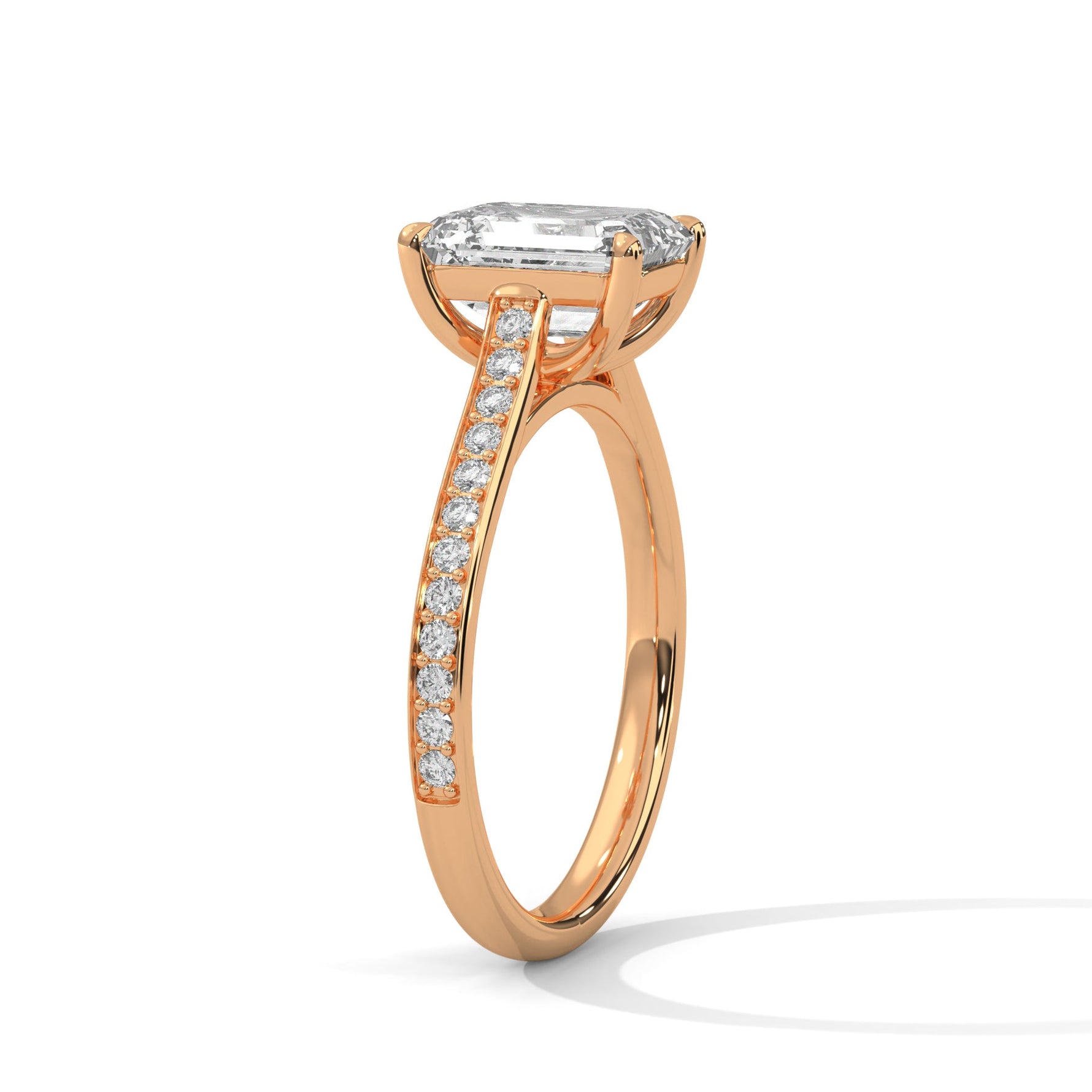 Rose gold ring with a large diamond on a white background 