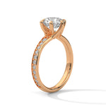 Rose gold ring with a large diamond on a white background 