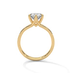 Gold ring with a large diamond on a white background 