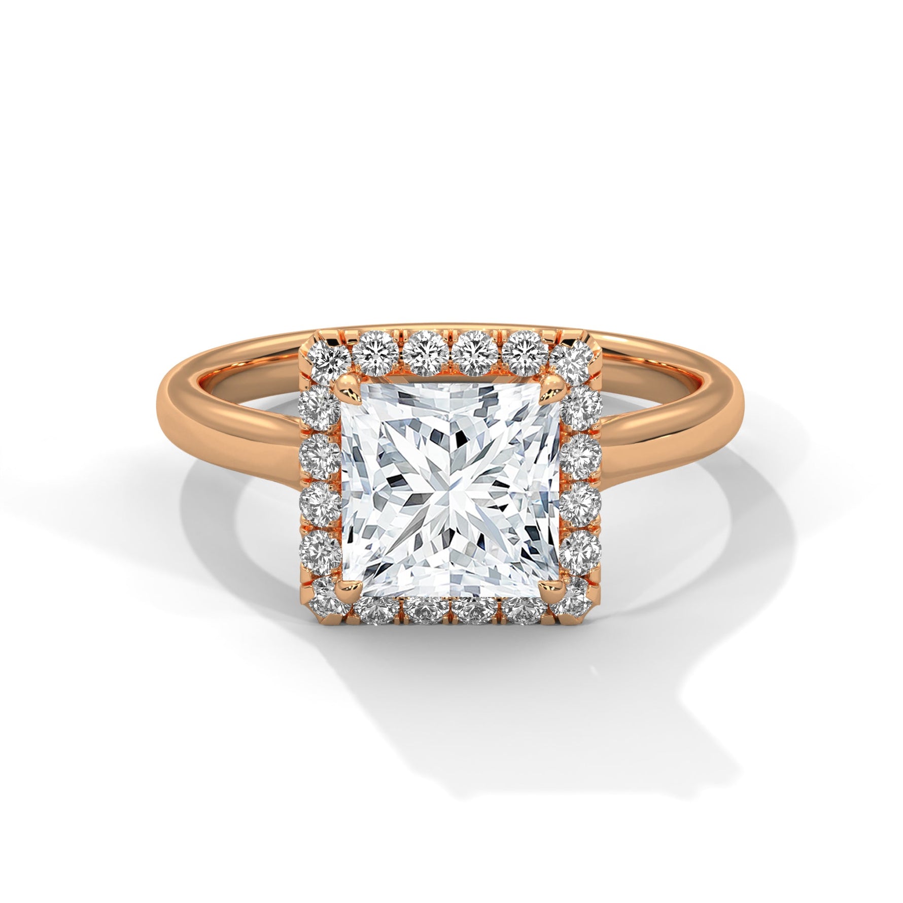 Rose gold ring with a large diamond on a white background 