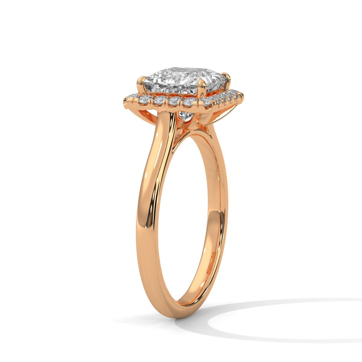 Rose gold ring with a large diamond on a white background 